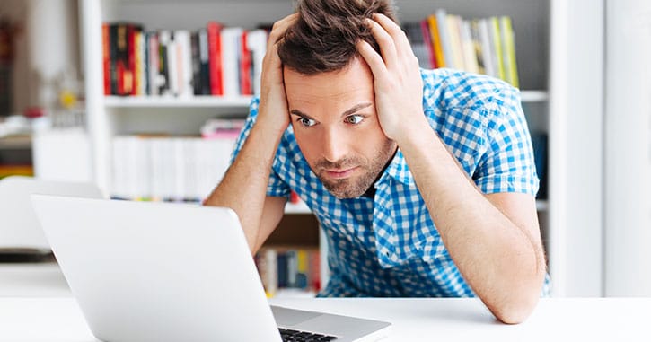 Man frustrated while researching identity theft protection options beyond a credit freeze.